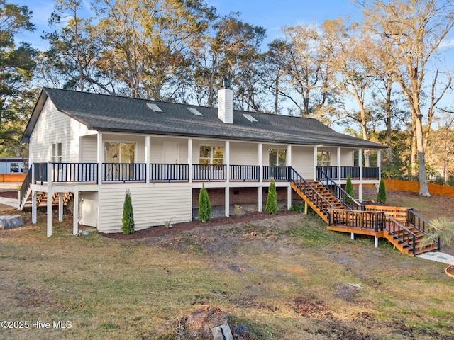 back of property with covered porch