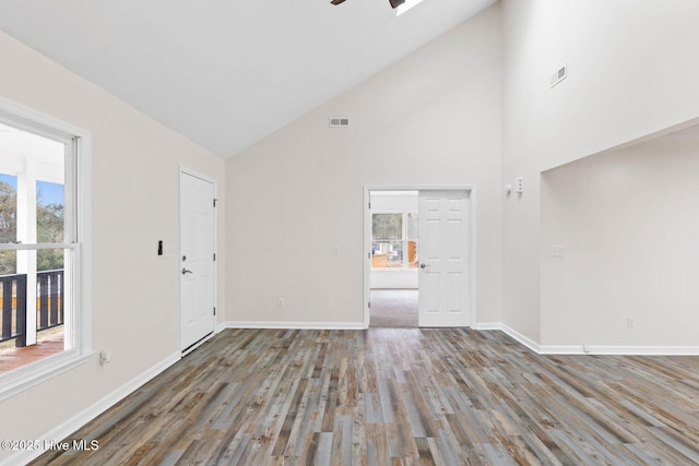 interior space with hardwood / wood-style floors, high vaulted ceiling, and ceiling fan