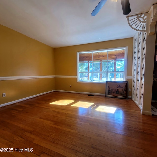 unfurnished living room with hardwood / wood-style flooring and ceiling fan