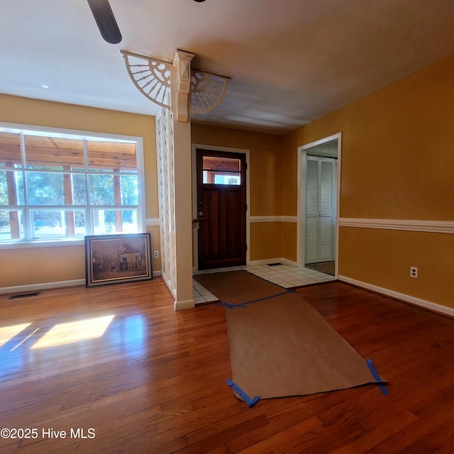 entrance foyer featuring wood-type flooring and ceiling fan