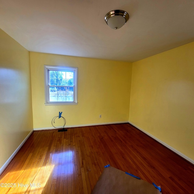 empty room with wood-type flooring