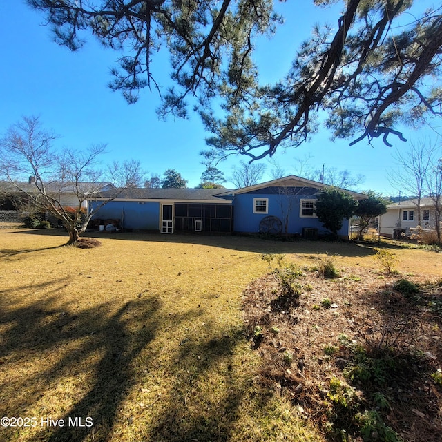 back of house with a yard