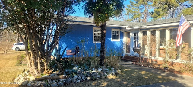 view of front of property featuring a sunroom