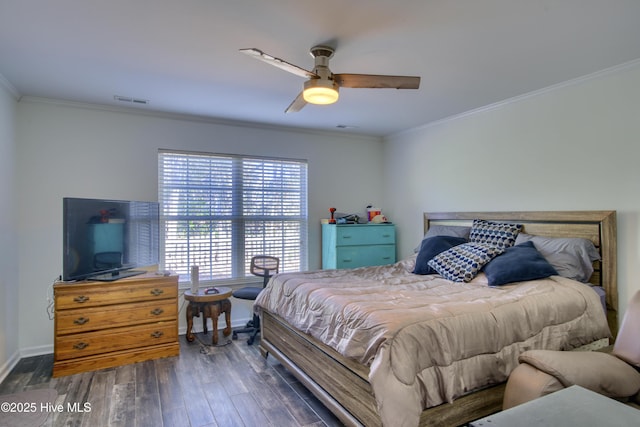 bedroom with ceiling fan, dark hardwood / wood-style flooring, and crown molding