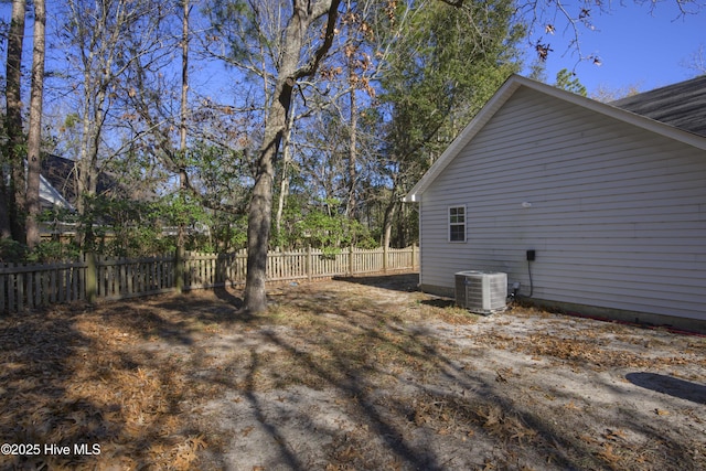 view of property exterior with central AC