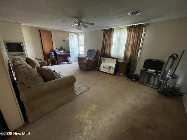 interior space featuring carpet flooring and ceiling fan