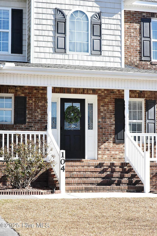 property entrance featuring a porch