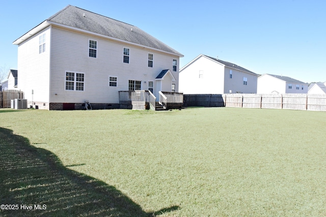 rear view of property featuring a wooden deck, a yard, and central air condition unit