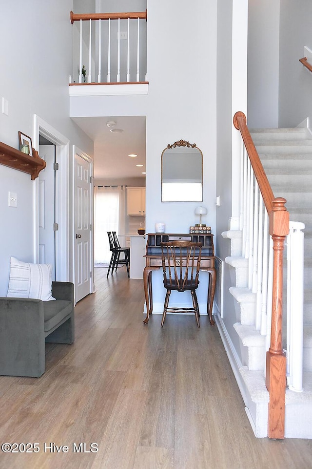 entryway with hardwood / wood-style flooring