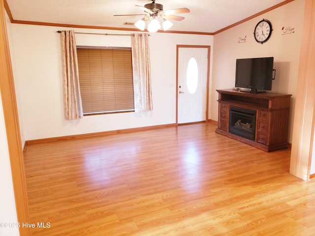 unfurnished living room with ceiling fan, crown molding, and light hardwood / wood-style floors