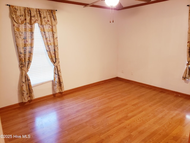 spare room featuring hardwood / wood-style flooring and ceiling fan