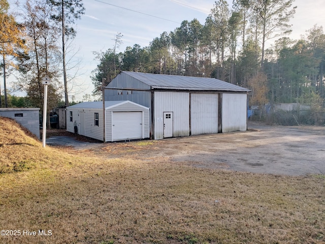 view of outdoor structure featuring a yard