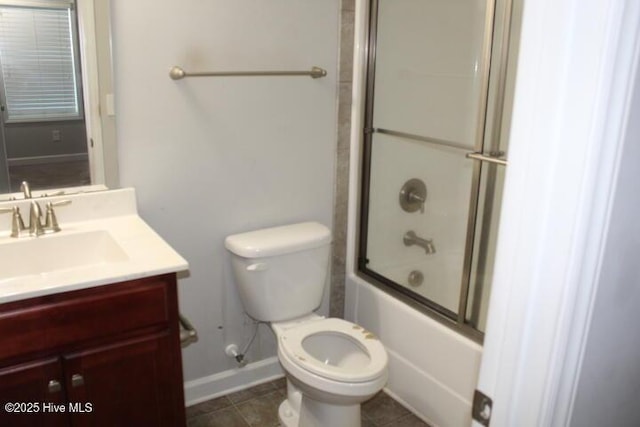 full bathroom with tile patterned floors, vanity, toilet, and enclosed tub / shower combo