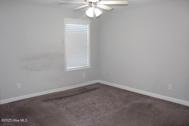 unfurnished room featuring ceiling fan and carpet floors