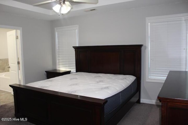 bedroom with ensuite bathroom and ceiling fan