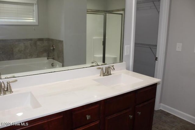 bathroom with vanity and plus walk in shower