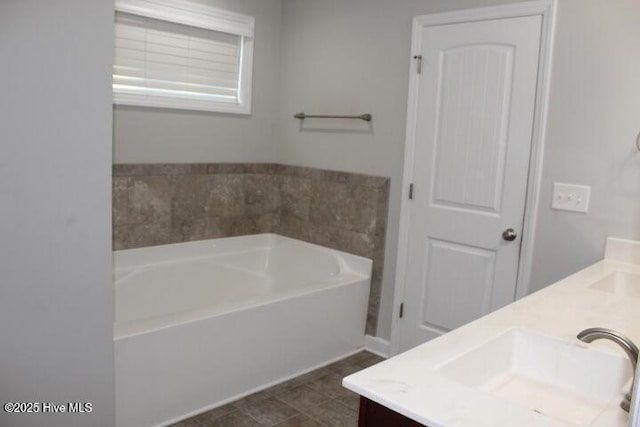 bathroom featuring a bathtub and vanity