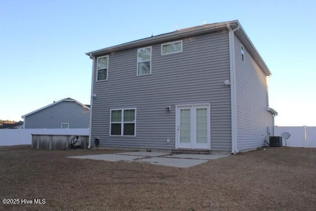 back of property featuring cooling unit