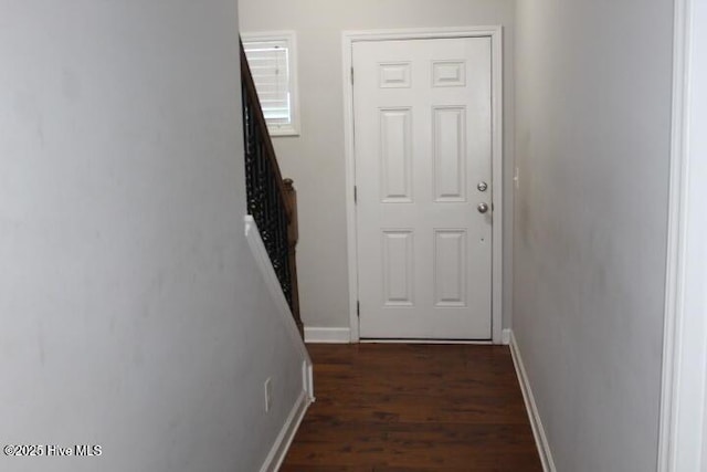 corridor featuring dark wood-type flooring