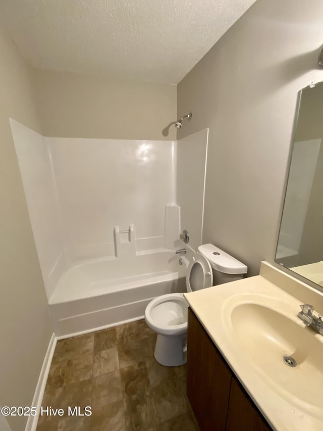 full bathroom featuring vanity, a textured ceiling, bathing tub / shower combination, and toilet