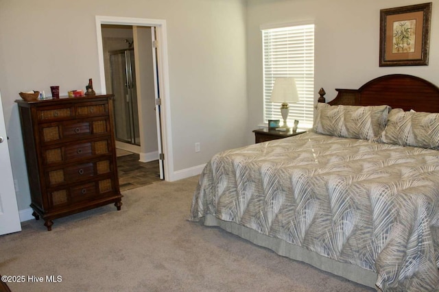 bedroom featuring carpet flooring and ensuite bathroom