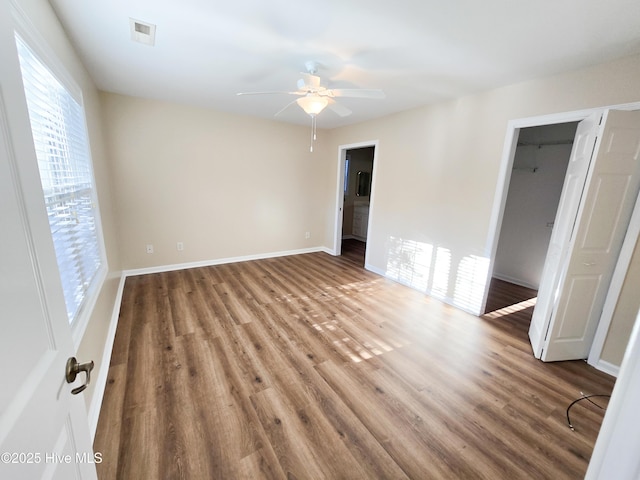 unfurnished room featuring hardwood / wood-style flooring and ceiling fan