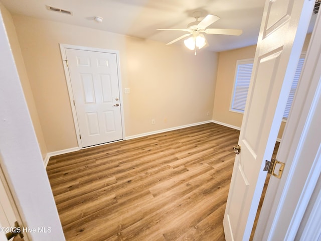 spare room with light hardwood / wood-style floors and ceiling fan