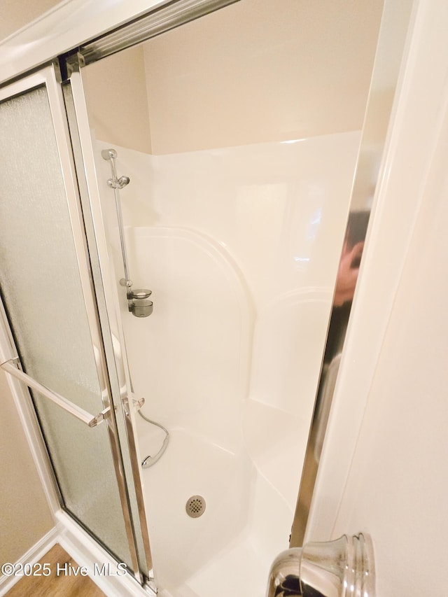 bathroom with an enclosed shower