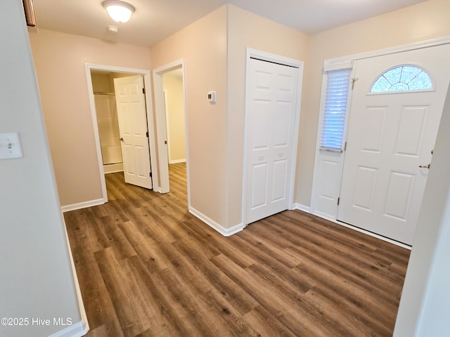 entryway with dark hardwood / wood-style floors