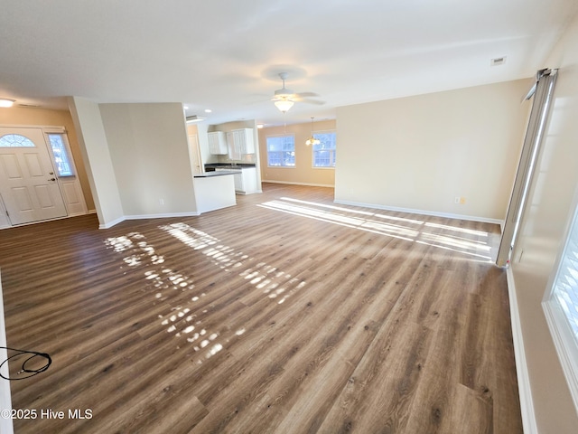 unfurnished living room with wood-type flooring