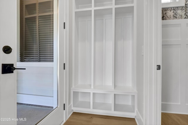 mudroom with wood-type flooring