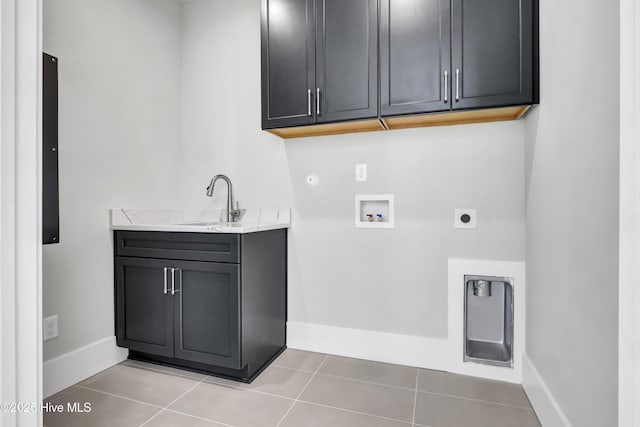 laundry room with sink, cabinets, washer hookup, light tile patterned floors, and electric dryer hookup