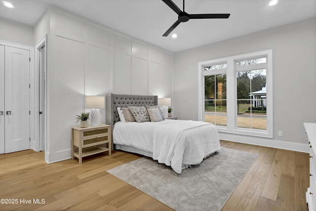 bedroom featuring ceiling fan and light hardwood / wood-style flooring