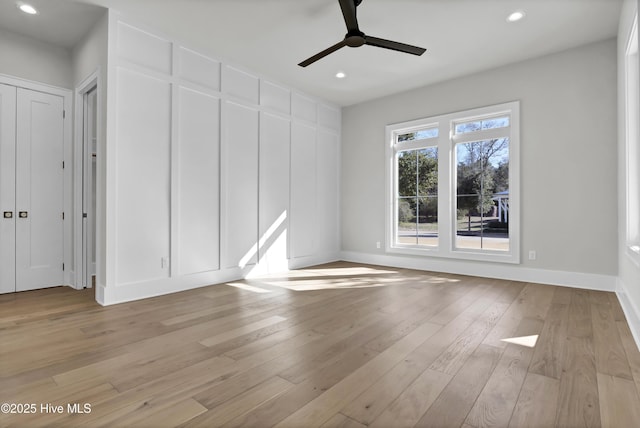 interior space featuring light hardwood / wood-style floors and ceiling fan