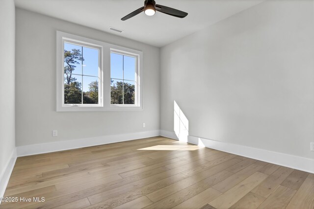 unfurnished bedroom with ensuite bathroom, ceiling fan, and light hardwood / wood-style flooring