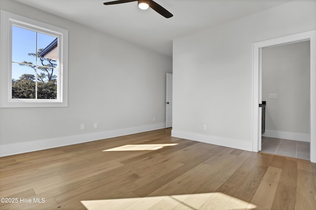 empty room featuring ceiling fan and light wood-type flooring