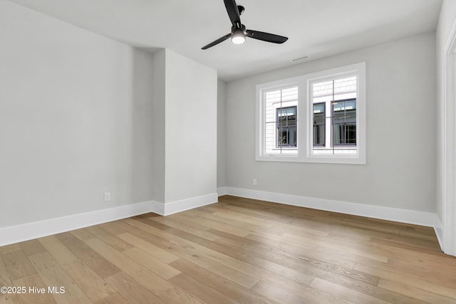 spare room with light hardwood / wood-style flooring and ceiling fan