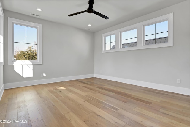 empty room featuring ceiling fan and light wood-type flooring