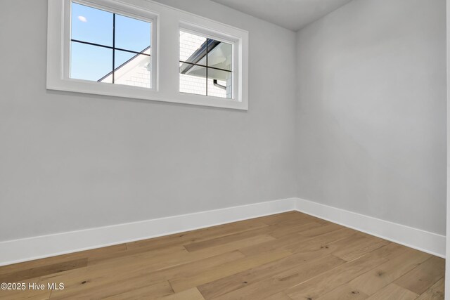 unfurnished room featuring light hardwood / wood-style floors