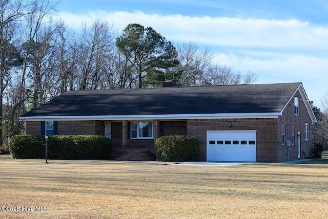 single story home with a garage and a front lawn