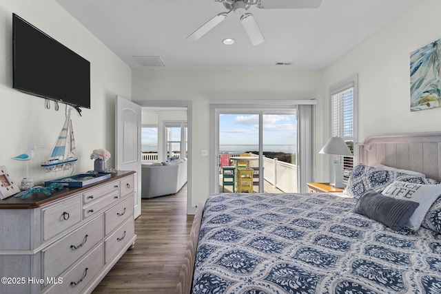 bedroom featuring visible vents, a ceiling fan, access to exterior, and dark wood-style flooring