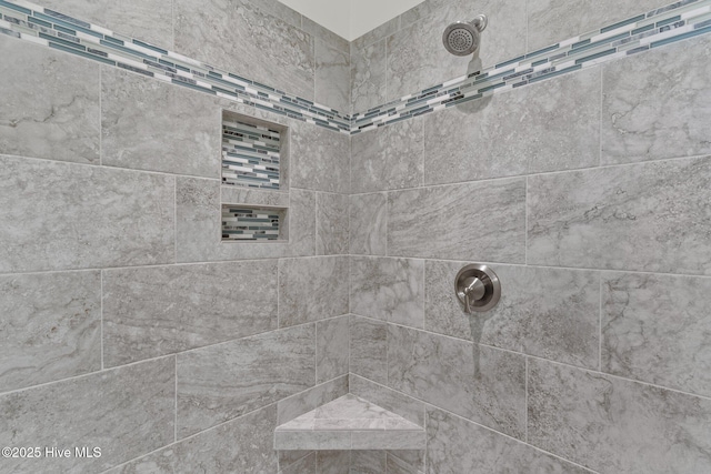 room details with a tile shower