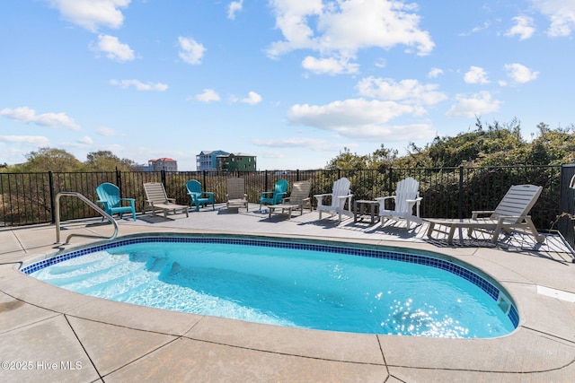 view of swimming pool featuring a fenced in pool, a patio, and fence