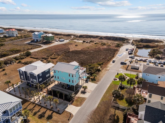 bird's eye view with a water view and a view of the beach