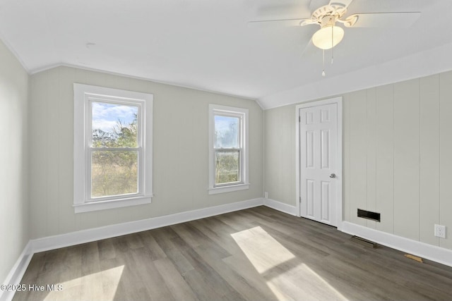 additional living space featuring ceiling fan, wood-type flooring, and lofted ceiling