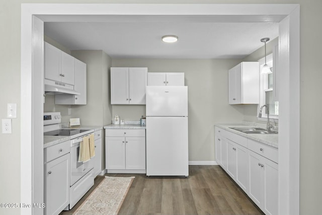 kitchen with white cabinetry, sink, pendant lighting, and white appliances