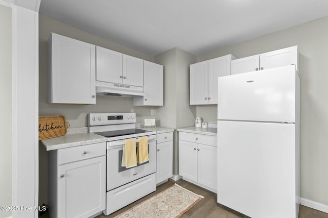 kitchen featuring dark hardwood / wood-style floors, white cabinetry, and white appliances