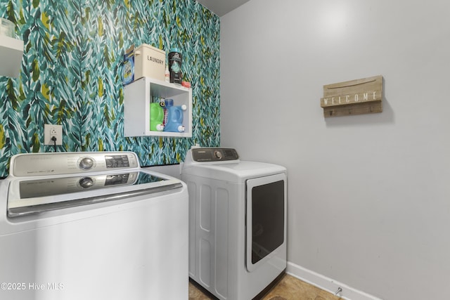 clothes washing area featuring washer and dryer