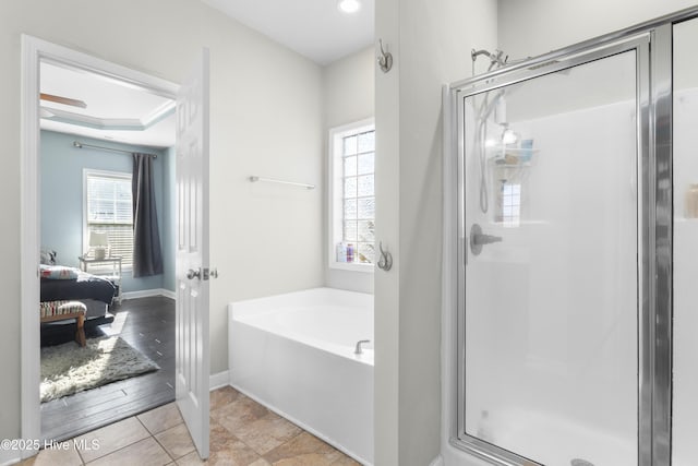 bathroom with tile patterned flooring and plus walk in shower