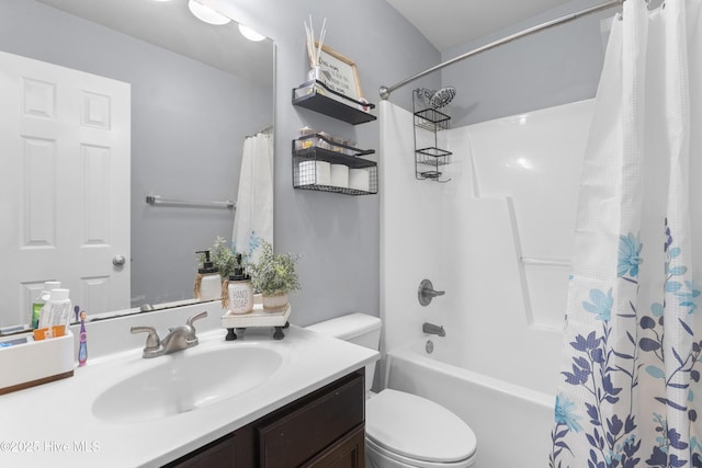 full bathroom featuring vanity, toilet, and shower / tub combo